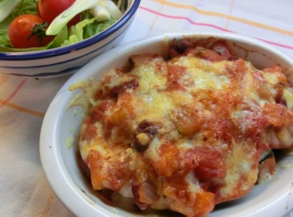 Baked sweet potato with cheesy vegetable chilli